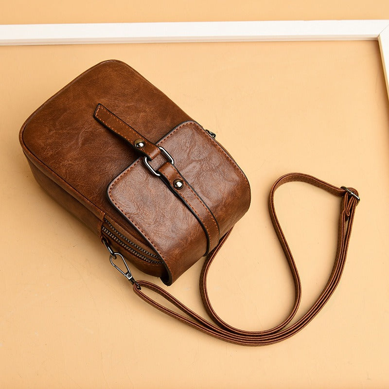 Bolso bandolera para mujer de piel sintética con bolsillo frontal estilo compacto - Daniela