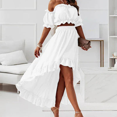 Elegante falda y top con volantes y hombros descubiertos, perfecta para un look femenino y sofisticado ideal para ocasiones especiales