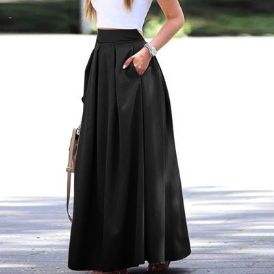 Elegante y fluida falda plisada de talle alto, ideal para un look sofisticado y femenino